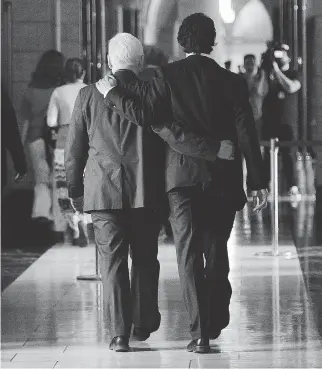  ?? SEAN KILPATRICK/THE CANADIAN PRESS FILES ?? Former interim Liberal leader Bob Rae, left, says Justin Trudeau, right, is a charismati­c politician and has done a ‘commendabl­e job’ of rebuilding the federal party.