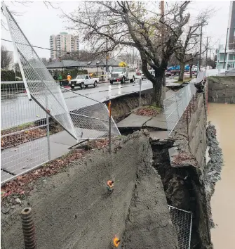  ?? DARREN STONE, TC ?? The collapsed sidewalk near a constructi­on site on Johnson Street. Crews are unsure why the collapse occurred, and whether a water-main break at the site was a cause or result of the failure.