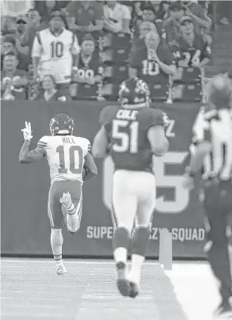  ?? Michael Ciaglo / Houston Chronicle ?? Kansas City’s Tyreek Hill (10) runs back an 82-yard punt return for a touchdown during the fourth quarter Sunday night at NRG Stadium.