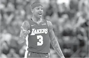  ?? AP Photo/Darron Cummings ?? ■ Los Angeles Lakers’ Isaiah Thomas argues a call during the first half of an NBA game against the Indiana Pacers on March 19 in Indianapol­is. No fewer than 33 players will make more during the 2018-19 season than Thomas has made in his entire career. “It’s all good though. ... I’ll just stay on that slow grind,” Thomas said on social media after agreeing with the Nuggets.