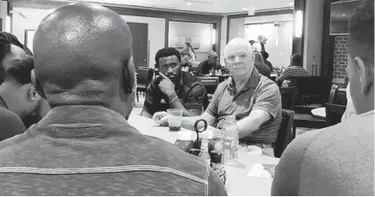  ?? OFFICE OF U.S. SEN. BEN CARDIN ?? U.S. Sen. Ben Cardin meets with a group of Ravens at their team headquarte­rs in September 2018 to discuss criminal-justice reform.