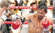  ?? THE ASSOCIATED PRESS ?? Manny Pacquiao, right, of the Philippine­s and Jeff Horn of Australia fight during their WBO World welterweig­ht title bout in Brisbane, Australia, on Sunday. Pacquiao lost his WBO welterweig­ht world title to Horn in a stunning, unanimous points decision...