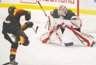  ?? RYAN REMIORZ/ THE CANADIAN PRESS ?? Canadian goaltender Joel Hofer stops Germany’s John Peterka on a breakaway in the second period on Monday during their 4-1 world junior group-stage win in Ostrava, Czech Republic.