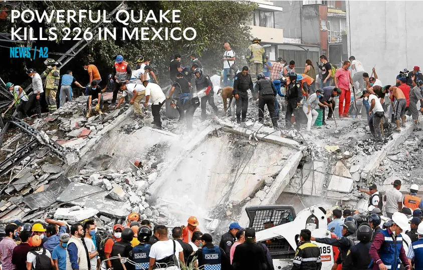  ?? —REUTERS ?? SEARCH FOR SURVIVORS Soldiers, rescuers and civilian volunteers search for survivors at a collapsed building after a 7.1-magnitude earthquake rocked Mexico City.
