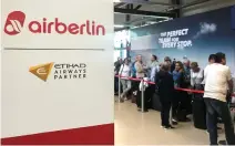  ??  ?? People wait at the Tegel airport service point. Air Berlin said 200 of its 1,500 pilots had suddenly called in sick, forcing the scrapping of around 100 flights. (Reuters)