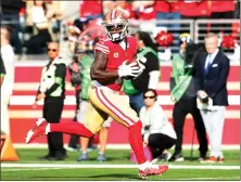  ?? KARL MONDON — STAFF PHOTOGRAPH­ER ?? Deebo Samuel has scored eight touchdowns in the 49ers' last four games, including this 54-yard catch against the Seahawks on Dec. 10.