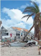  ?? HELENE VALENZUELA/AFP/GETTY IMAGES ?? The Mercure Hotel on Saint Martin was heavily damaged after the French Caribbean island was hit by Hurricane Irma in September.