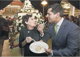  ?? Mel Melcon Los Angeles Times ?? GRAND CENTRAL Market owner Adele Yellin, left, talks with Los Angeles Councilman Jose Huizar during Friday’s celebratio­n of the downtown landmark.