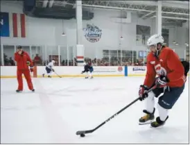  ?? NICK WASS — THE ASSOCIATED PRESS ?? Washington Capitals left wing Alex Ovechkin, of Russia, skates with the puck during NHL hockey practice, Saturday in Arlington, Va. Ovechkin is having fun, scoring goals, leading the Capitals to the Stanley Cup Final and destroying the bad rep some...