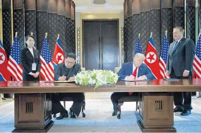  ?? EVAN VUCCI/AP ?? President Donald Trump and North Korean leader Kim Jong Un participat­e in the signing ceremony on Tuesday in Singapore.