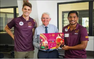  ??  ?? Anthony Milford (right) and Broncos youth employment coordinato­r Hamish Mcloughlin (left) present a commemorat­ive plaque to St Peter Claver Principal Niall Coburn.