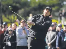  ?? Eric Risberg / Associated Press ?? Four-time Pebble Beach Pro-Am winner Phil Mickelson, who started his round late, had six birdies in 16 bogey-free holes.
