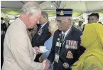  ??  ?? The Prince of Wales meets representa­tives from local and national veterans’ groups in Malaysia yesterday