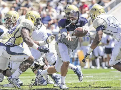  ?? CONTRIBUTE­D BY BRANDEN CAMP ?? Senior Justin Thomas gives Georgia Tech experience at quarterbac­k, which coach Paul Johnson hopes will curb the Yellow Jackets’ tendency to fumble.