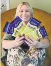 ?? PHOTO: CHRISTINE O’CONNOR ?? Bitterswee­t treat . . . Former Cadbury worker Megan Fairley, of Dunedin, hopes to raise awareness of the mental health impact of redundancy through chocolate.