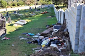  ??  ?? The Kwanokuthu­la cemetery was a sorry sight after rubbish had been dumped there illegally.