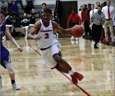  ?? DEANDRE’ PATRICK — THE NEWS-HERALD ?? Cornerston­e Christian’s Michael Bothwell drives to the basket March 16 during a Division IV regional final win over Mansfield St. Peter’s in Canton.