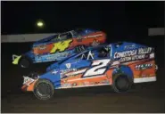  ?? RICH KEPNER — DIGITAL FIRST MEDIA FILE ?? Mike Gular (2) and Ryan Watt (14) duel during the main event of the Thunder on the Hill season finale at Grandview Speedway earlier this month.