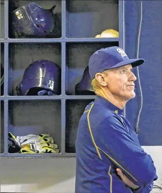  ??  ?? ASSOCIATED PRESS Brewers Manager Ron Roenicke watches the game against the Cincinnati Reds last month in Milwaukee. Doug Melvin said the decision was made to fire Roenicke after a 5-17 month of April.
RON ROENICKE’S CAREER MANAGERIAL RECORD