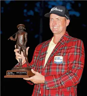  ?? — aFP ?? Sweet victory: Webb simpson poses with the RBC Heritage trophy after winning his second tournament of the year on sunday.