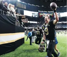  ?? BILL FEIG/THE ASSOCIATED PRESS ?? Record-setting quarterbac­k Drew Brees and his New Orleans Saints are 7-1 while averaging 35 points a game. They’re one of several top teams winning primarily due to offensive prowess.