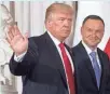  ?? SAUL LOEB, AFP/GETTY IMAGES ?? Polish President Andrzej Duda greets President Trump before meetings at the Royal Castle in Warsaw on Thursday.