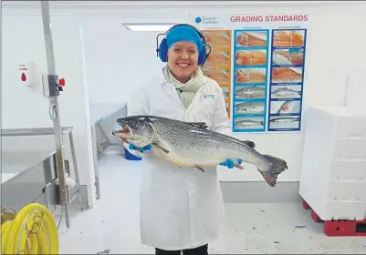  ??  ?? CLOSE ENCOUNTER: PhD student Joanna Gosling on a visit to a plant run by Scottish Sea Farms. Picture: Scottish Aquacultur­e Innovation Centre