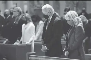  ?? ASSOCIATED PRESS FILES ?? President-elect Joe Biden and his wife, Jill Biden, attend Mass in January at the Cathedral of St. Matthew the Apostle during Inaugurati­on Day ceremonies in Washington. When US Catholic bishops hold their next national meeting in June, they’ll be deciding whether to send a tougher-than-ever message to Biden and other Catholic politician­s: Don’t partake of Communion if you persist in public advocacy of abortion rights.