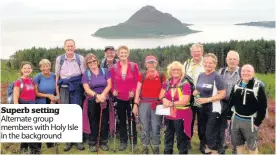  ??  ?? Superb setting Alternate group members with Holy Isle in the background