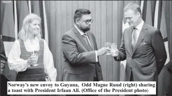  ?? ?? Norway’s new envoy to Guyana, Odd Magne Ruud (right) sharing a toast with President Irfaan Ali. (Office of the President photo)