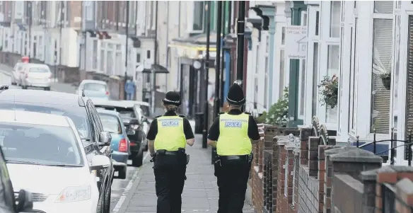  ??  ?? Police patrolling Roker Avenue.