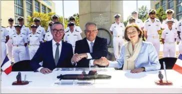  ?? EPA-EFE/THE STRAITS TIMES ?? Australian Prime Minister Scott Morrison attended a ceremony in Canberra to sign a A$50 billion (US$35.485 billion) contract with France to build 12 state of the art submarines on Monday.