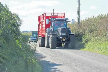  ??  ?? BE PATIENT: If traffic is building behind a tractor, it will pull in where it is safe to do so.