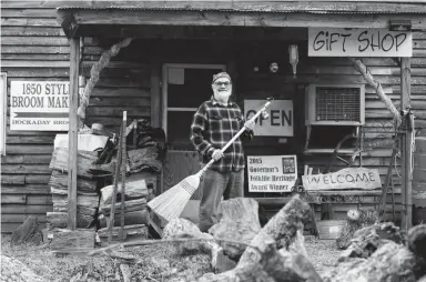  ?? JAMAR COACH/JACKSON SUN ?? Broom-maker Jack Martin poses for a photo outside Hockaday Brooms in Selmer on Mar. 8.