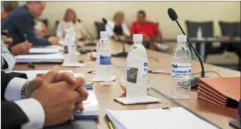  ?? MEDIANEWS GROUP FILE PHOTO ?? Chester Water Authority bottles sits on table during a recent meeting of its board.