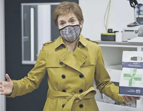  ??  ?? 0 The SNP’S prescripti­on for government - Nicola Sturgeon was on a campaign visit to a Burnside chemist in Rutherglen