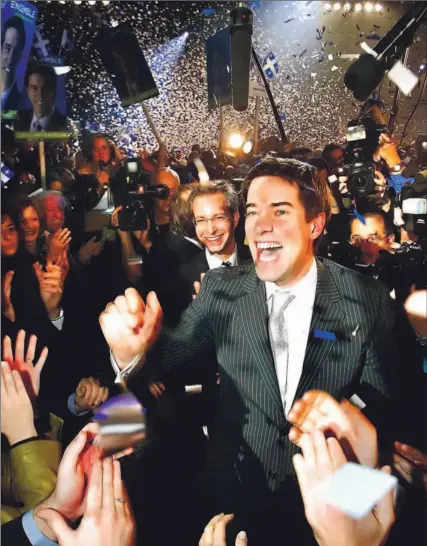  ?? CLEMENT ALLARD/ CP ?? A jubilant André Boisclair is congratula­ted last night after winning the Parti Québécois leadership race in Quebec City. Boisclair rolled over his rivals, brushing aside criticism of his past cocaine use and doubts about his resolve in the face of crisis.