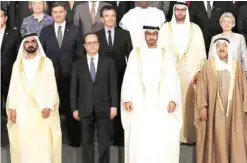  ?? — AFP ?? ABU DHABI: (From right) HH the Amir of Kuwait Sheikh Sabah Al-Ahmad Al-Jaber AlSabah, Crown Prince of Abu Dhabi Sheikh Mohamed bin Zayed Al-Nahyan, French President Francois Hollande and UAE Prime Minister Sheikh Mohammed bin Rashid Al-Maktoum pose for...