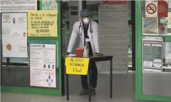  ?? Fernando Llano / Associated Press ?? Dr. Jose Antonio Gama calls for the next patient at a health clinic dedicated to testing and treatment of COVID19 in Mexico City. Mexico’s economy will begin reopening next week.