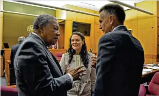  ?? HYOSUB SHIN / HSHIN@AJC.COM ?? Robb Pitts (left), chairman of the Fulton County Board of Commission­ers, celebrates Tuesday with Atlanta Schools Superinten­dent Meria Carstarphe­n and Jeff Rose, superinten­dent of the Fulton County Schools, after Judge Alan Harvey ruled that they could collect property taxes despite thousands of pending valuation appeals. The money is critical for school operations.