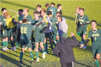  ?? ADOLPHE PIERRE-LOUIS/JOURNAL ?? Mayfield players celebrate after their win over Volcano Vista in the Class 5A semifinals Thursday. The Trojans will play Cleveland for the Class 5A boys championsh­ip today.