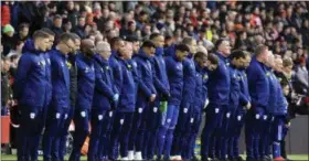  ?? MARK KERTON - THE ASSOCIATED PRESS ?? Cardiff City players observe a minute of silence in tribute to Emiliano Sala ahead of the English Premier League soccer match between Southampto­n and Cardiff City at St Mary’s Stadium, Southampto­n, England, Saturday Feb. 9, 2019.