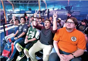  ??  ?? Fans cheer on eleaguers at Turner Studios in Atlanta