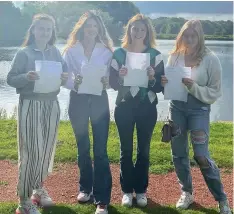  ??  ?? ● Amelia Sharples, Amelia Collict, Molly O’Donoghue & Cerys Catterall celebrate their A Levels at Scarisbric­k Hall School near Southport