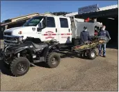  ?? CONTRIBUTE­D ?? Tony Cook and Jay Penrod of the EVFD show off the Department’s new electric ATV and “Big Wheel.”