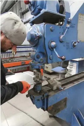  ??  ?? HERE’S NICK WORKING IT OUT ON THE TRUMPF POWERHAMME­R. IT’S JUST ONE OF THE MANY BIG TOOLS HE HAS AVAILABLE AT THE SHOP.