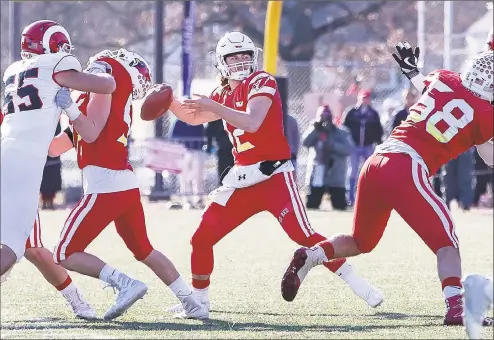  ?? John McCreary / For Hearst Connecticu­t Media ?? Former Greenwich QB Gavin Muir throws a pass during the Class LL State Championsh­ip game against New Canaan in 2018 at Boyle Stadium in Stamford. A sophomore at Dartmouth, Muir was slated to compete for the backup quarterbac­k job, but will have to wait since the Ivy League canceled sports during the fall semester.