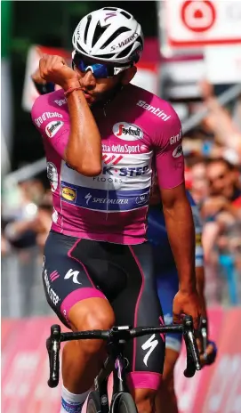  ??  ?? Colombian Fernando Gaviria from QuickStep-Floors crosses the finish line to win the 12th stage of the 100th Giro d’Italia in Reggio Emilia