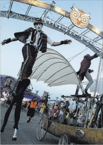  ?? Bridget Bennett Las Vegas Review-Journal @bridgetkbe­nnett ?? Attendees groove Friday on the Parliament artcar, the newest addition to the festival’s artcars, on the first night of Electric Daisy Carnival at Las Vegas Motor Speedway.