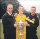  ?? ?? With the trophy in 2004 – and Davy’s brother Ernie on the left.